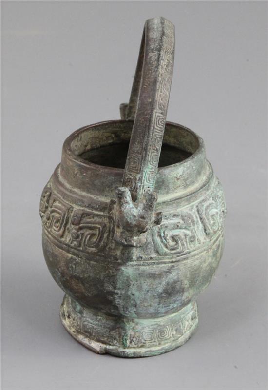 A small Chinese archaic bronze ritual wine vessel, You, Western Zhou dynasty, 10th century B.C., 13cm high, lacking cover
